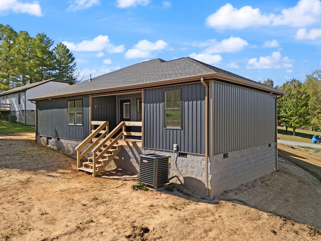 back of house featuring central AC