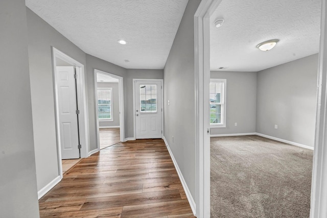 entrance foyer featuring hardwood / wood-style floors and a textured ceiling