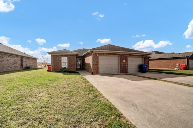 ranch-style house featuring a front lawn, a garage, and central AC unit