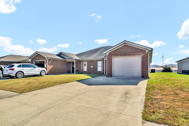 ranch-style house with a garage and a front yard