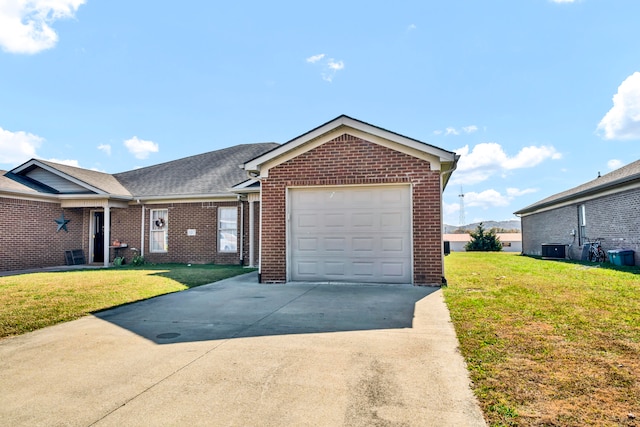 view of front of property with a garage and a front yard