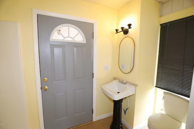 bathroom with tile patterned floors and toilet