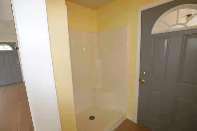 bathroom featuring tile patterned floors and walk in shower