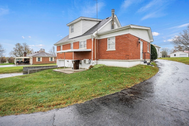 view of property exterior featuring a lawn