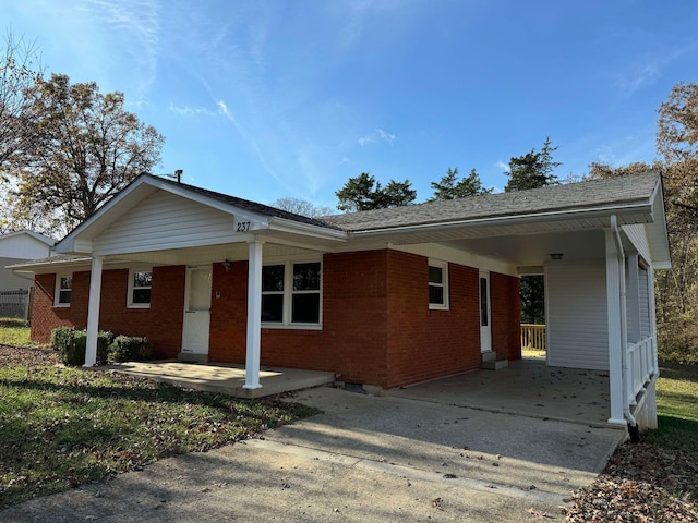 single story home with a carport