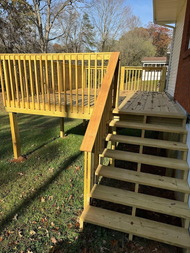 wooden deck with a yard