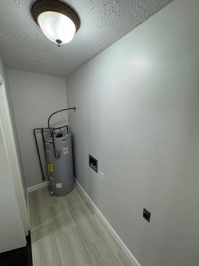 utility room featuring water heater