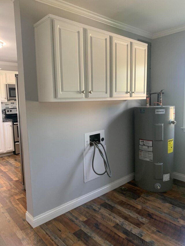 washroom with hookup for an electric dryer, dark wood-type flooring, cabinets, electric water heater, and crown molding