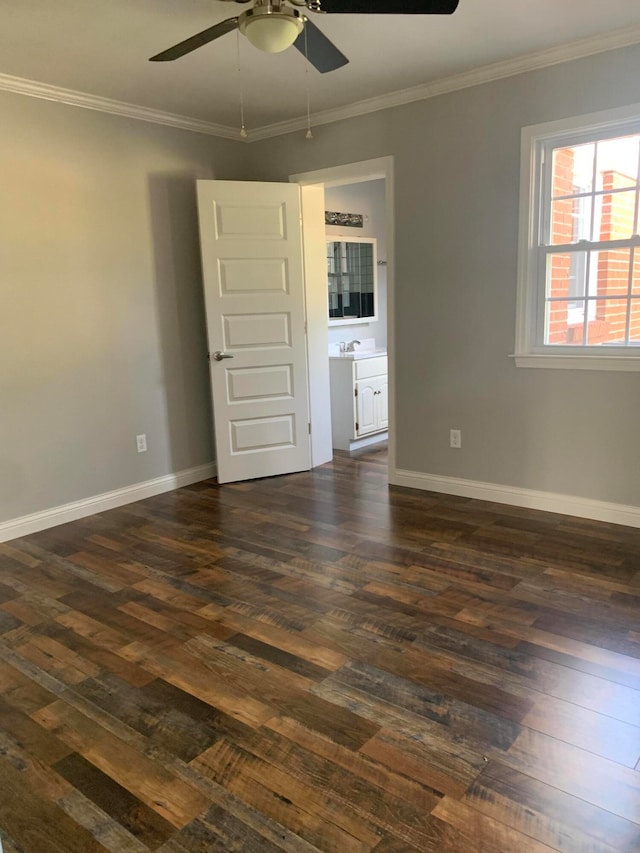 spare room with ornamental molding, dark hardwood / wood-style floors, and ceiling fan