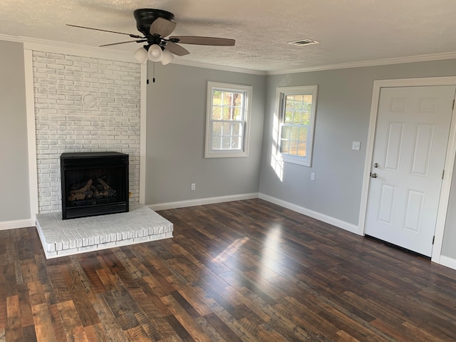 unfurnished living room with ornamental molding, dark hardwood / wood-style flooring, a textured ceiling, and ceiling fan