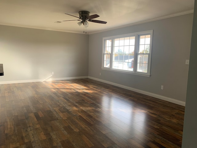 unfurnished room with ornamental molding, dark hardwood / wood-style floors, and ceiling fan