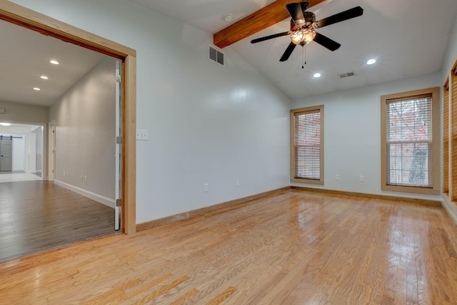 unfurnished room with lofted ceiling with beams, light hardwood / wood-style floors, and ceiling fan