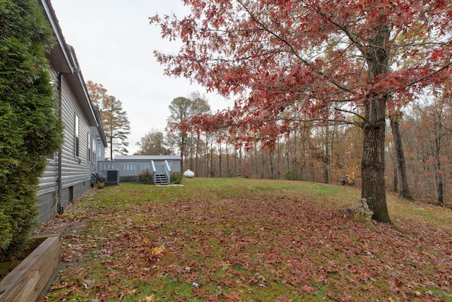 view of yard featuring central AC