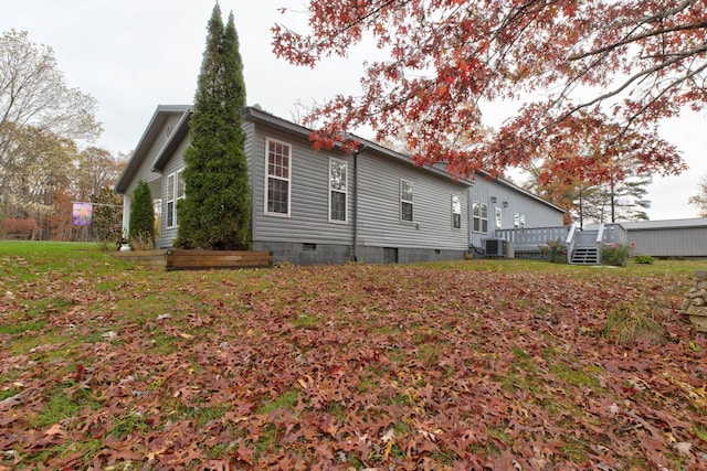 rear view of house featuring a deck and central air condition unit