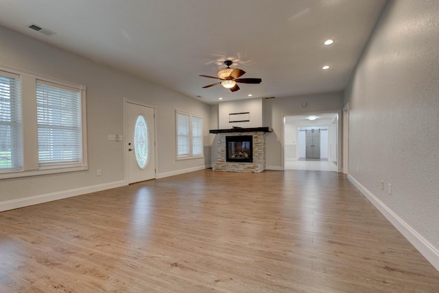 275 Johnson Rd, Morehead, KY 40351 - unfurnished living room with ceiling fan, light wood-style floors, a stone fireplace, baseboards, and recessed lighting