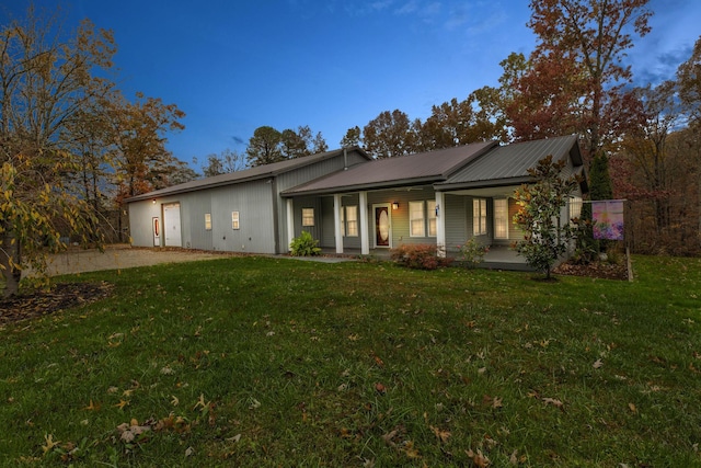 view of front of house with a lawn and covered porch