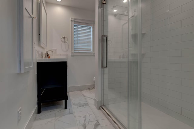 bathroom featuring a shower with door, vanity, and toilet