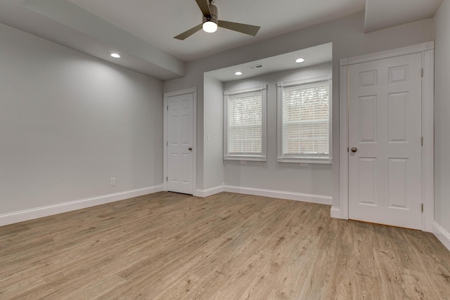 unfurnished room featuring light wood-type flooring and ceiling fan