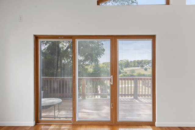 doorway to outside with light hardwood / wood-style flooring