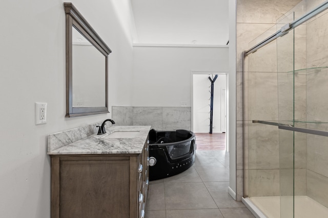 bathroom featuring tile patterned floors, vanity, and a shower with shower door