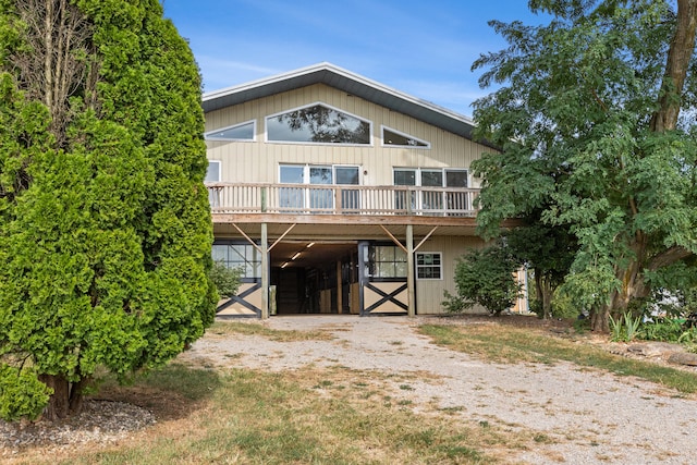 583 College Rd, Paris, KY 40361 - rear view of house featuring a carport, an outdoor structure, an exterior structure, and a deck