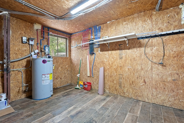 utility room featuring water heater