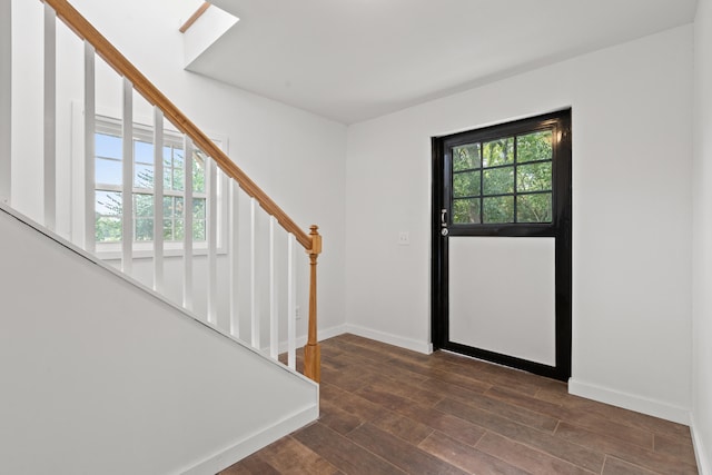 entryway with dark hardwood / wood-style floors