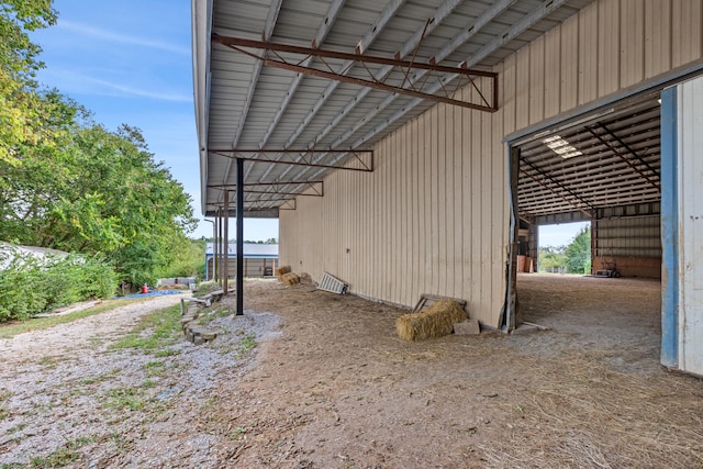 view of side of property with an outbuilding