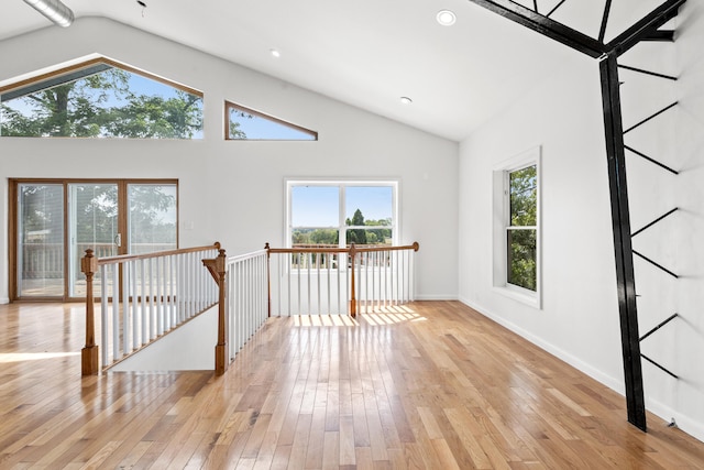 583 College Rd, Paris, KY 40361 - spare room with vaulted ceiling, light wood-style floors, healthy amount of natural light, and baseboards