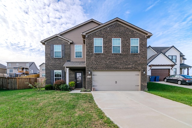 view of front of property featuring a garage and a front lawn