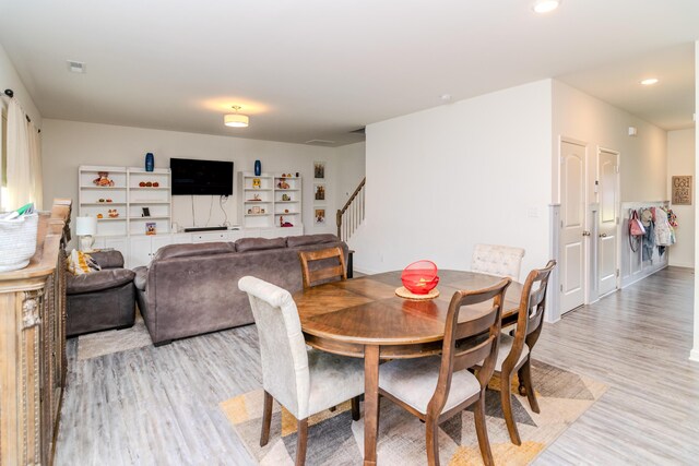 dining room featuring sink and hardwood / wood-style flooring