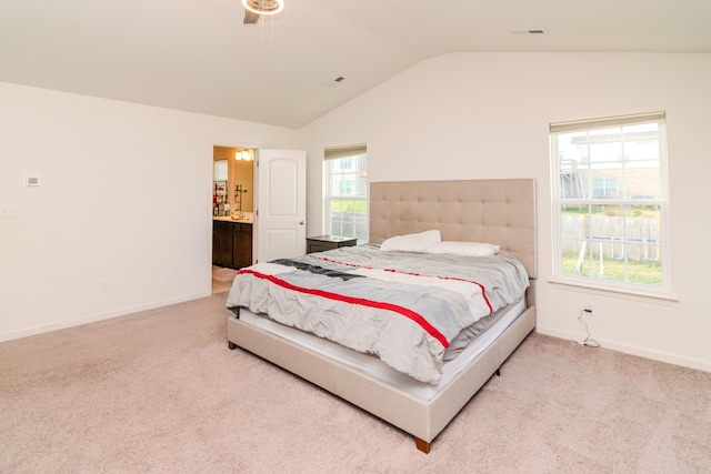 carpeted bedroom featuring multiple windows, lofted ceiling, and ceiling fan