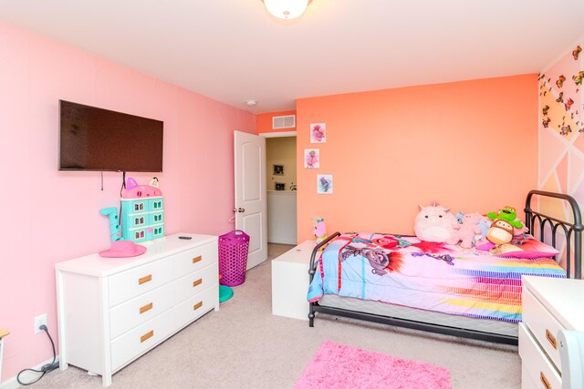 bedroom with light colored carpet