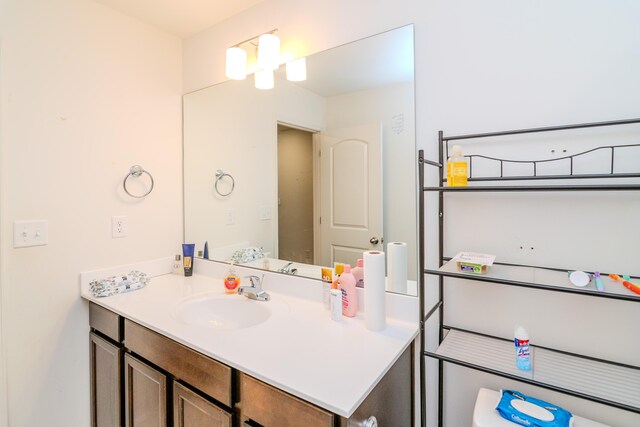 full bathroom with vanity, shower / bath combination with curtain, and toilet