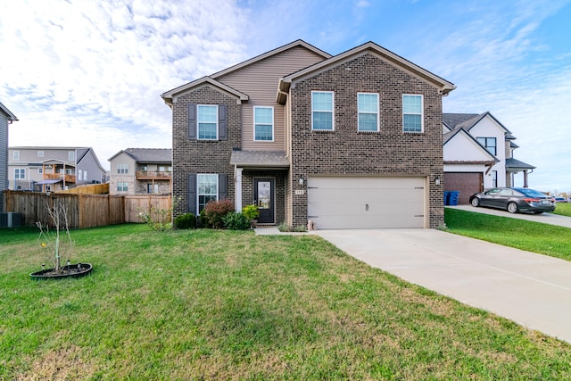 view of front of home with a garage and a front yard