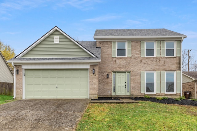 view of front of property with a garage and a front lawn