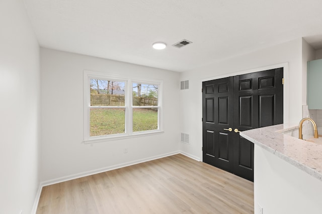 entryway with light hardwood / wood-style floors