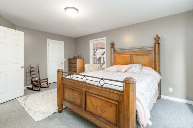 bedroom featuring light carpet