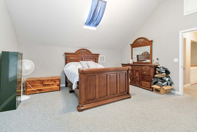 carpeted bedroom with lofted ceiling