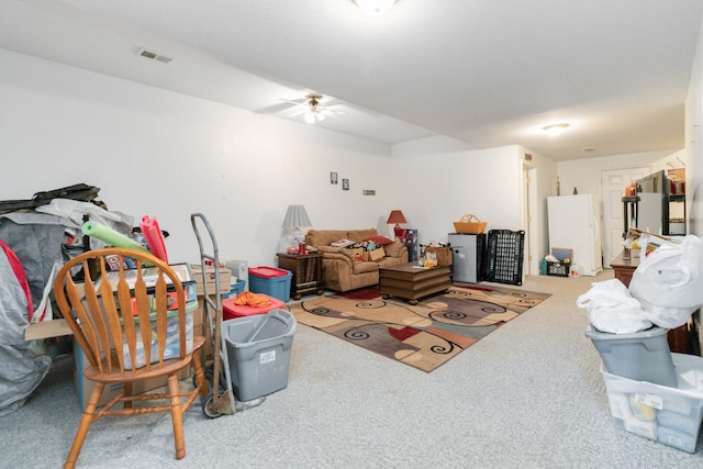 interior space with ceiling fan