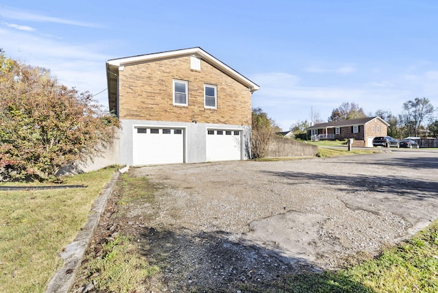 view of property exterior with a garage