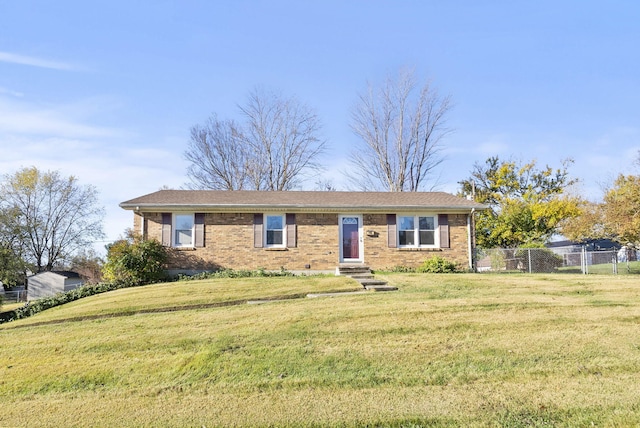 ranch-style house featuring a front lawn