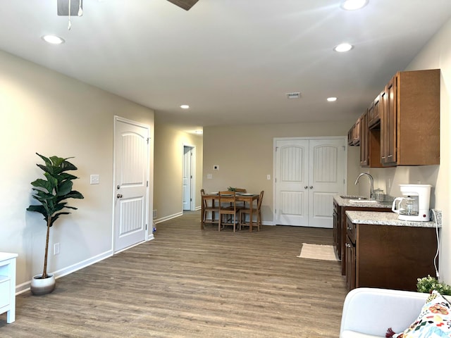 kitchen with dark hardwood / wood-style floors and sink