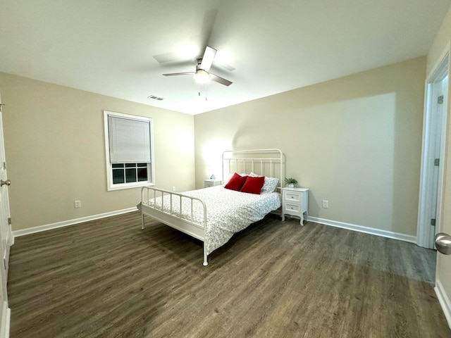 bedroom featuring ceiling fan and dark hardwood / wood-style flooring