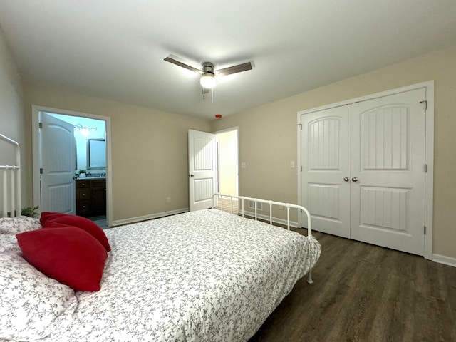 bedroom featuring ceiling fan, dark hardwood / wood-style floors, a closet, and ensuite bath