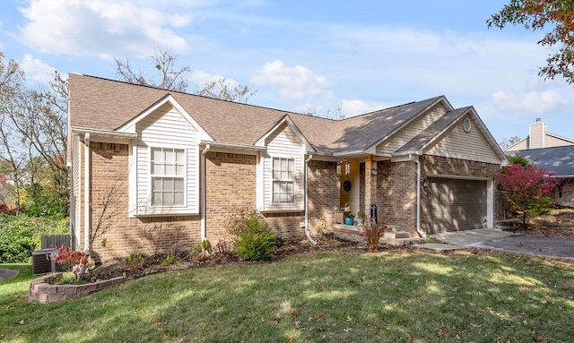 view of front of house featuring a garage and a front lawn