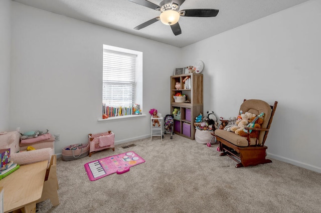 playroom featuring ceiling fan and light colored carpet