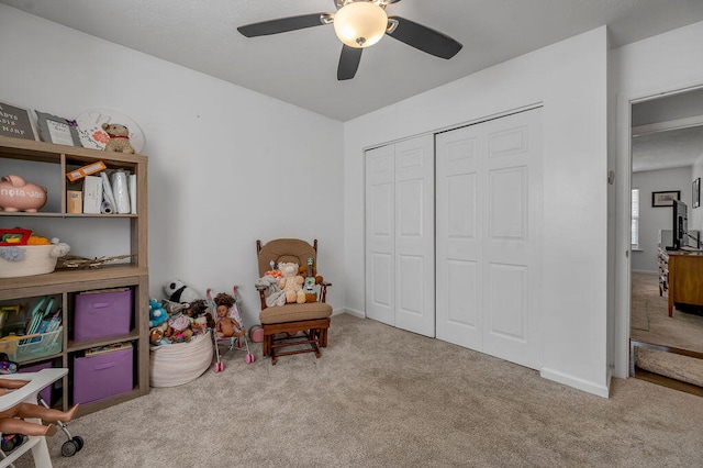 interior space featuring ceiling fan and light carpet