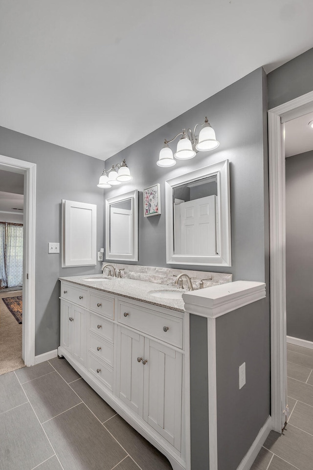 bathroom with tile patterned flooring and vanity