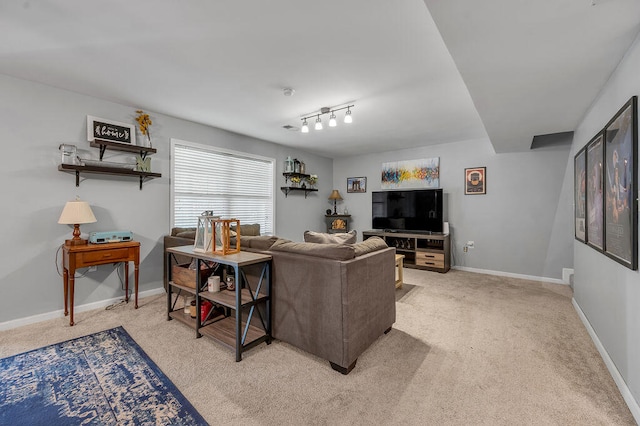 living room featuring track lighting and light carpet